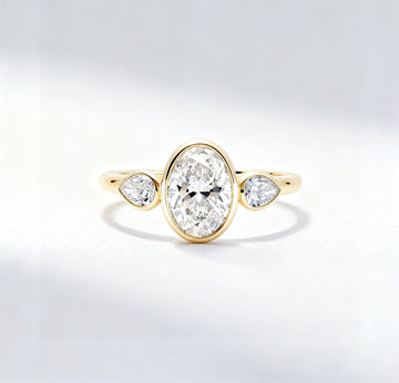 3.00 ct Oval Lab Grown Diamond Three-Stone Bezel Ring  with Pear Side Stones