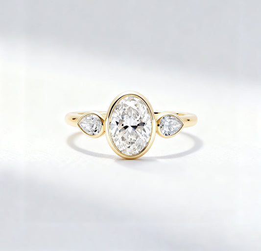 3.00 ct Oval Lab Grown Diamond Three-Stone Bezel Ring  with Pear Side Stones