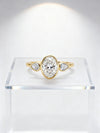 3.00 ct Oval Lab Grown Diamond Three-Stone Bezel Ring  with Pear Side Stones