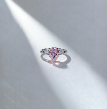 1.50 ct Pear Lab Grown Pink Diamond Three-Stone Ring with Trapezoid Side Stones