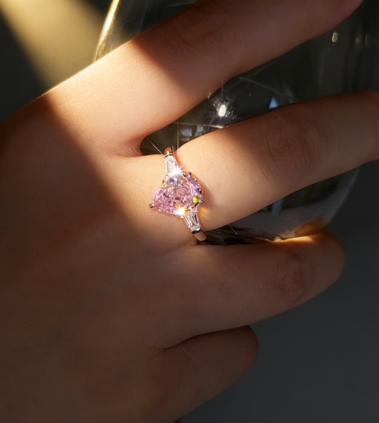 1.50 ct Pear Lab Grown Pink Diamond Three-Stone Ring with Trapezoid Side Stones
