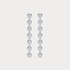 Pair of diamond earrings on a light gray background