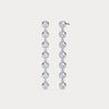 Pair of diamond earrings on a light gray background