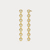 Gold earrings with clear stones on a light gray background