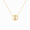 Gold necklace with a circular pendant on a white background