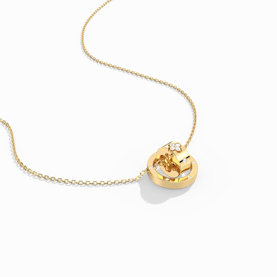 Gold necklace with a heart-shaped pendant on a white background