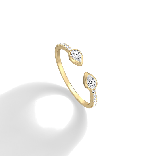 Gold open ring with diamond accents on a white background
