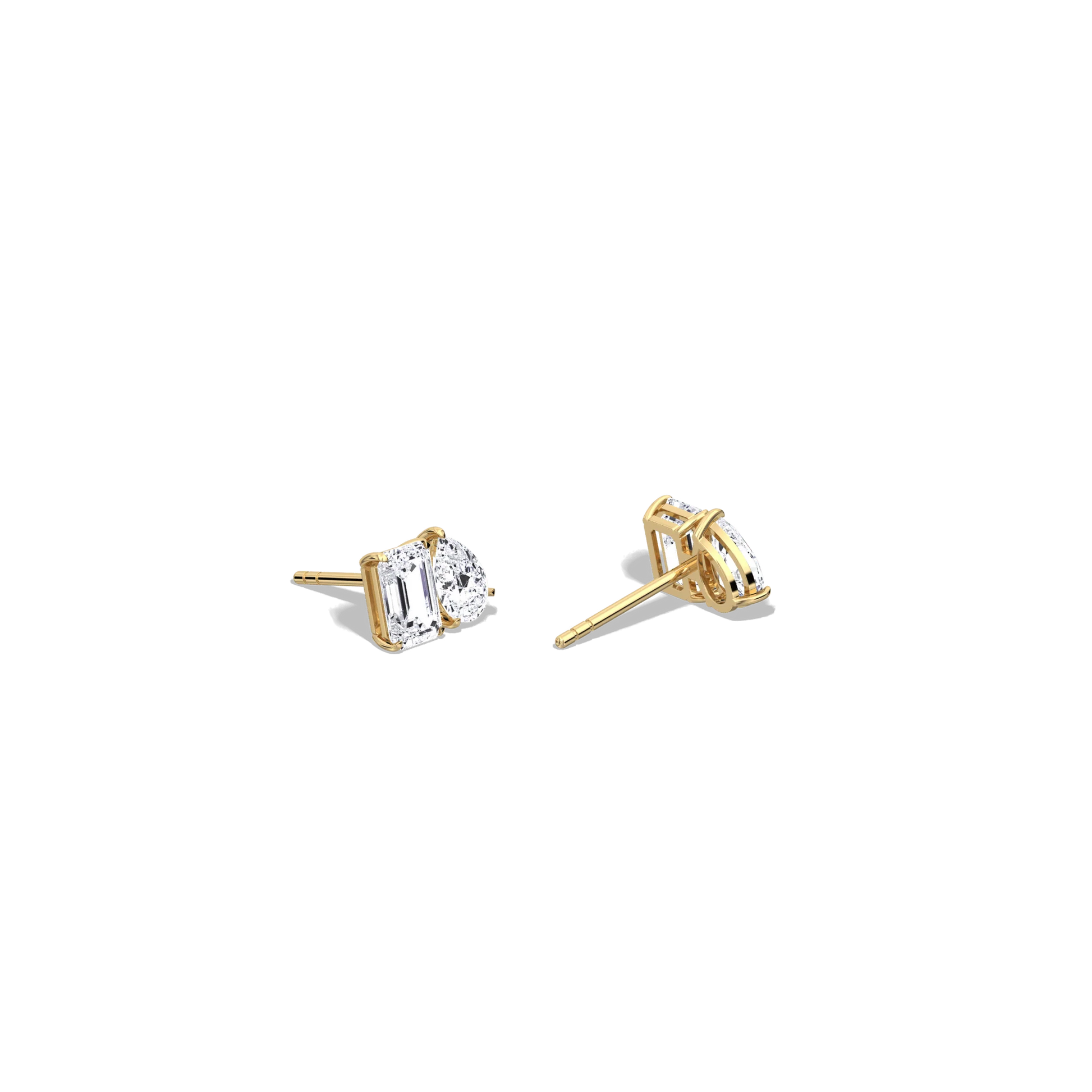 Gold earrings with clear gemstones on a white background