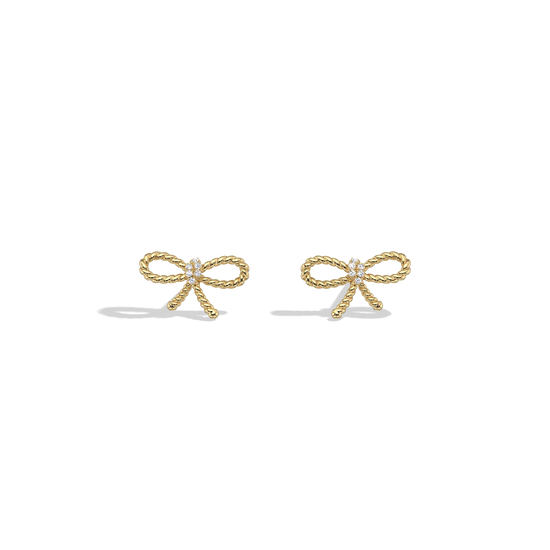 Gold bow-shaped earrings on a white background