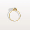 Gold ring with a diamond on a light gray background