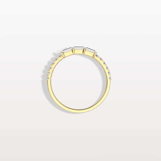 Gold ring with small diamonds on a light gray background