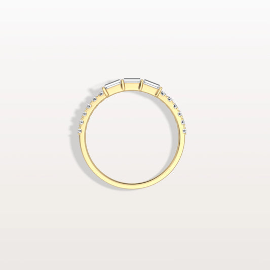 Gold ring with small diamonds on a light gray background