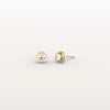 Gold stud earrings with gemstones on a light gray background