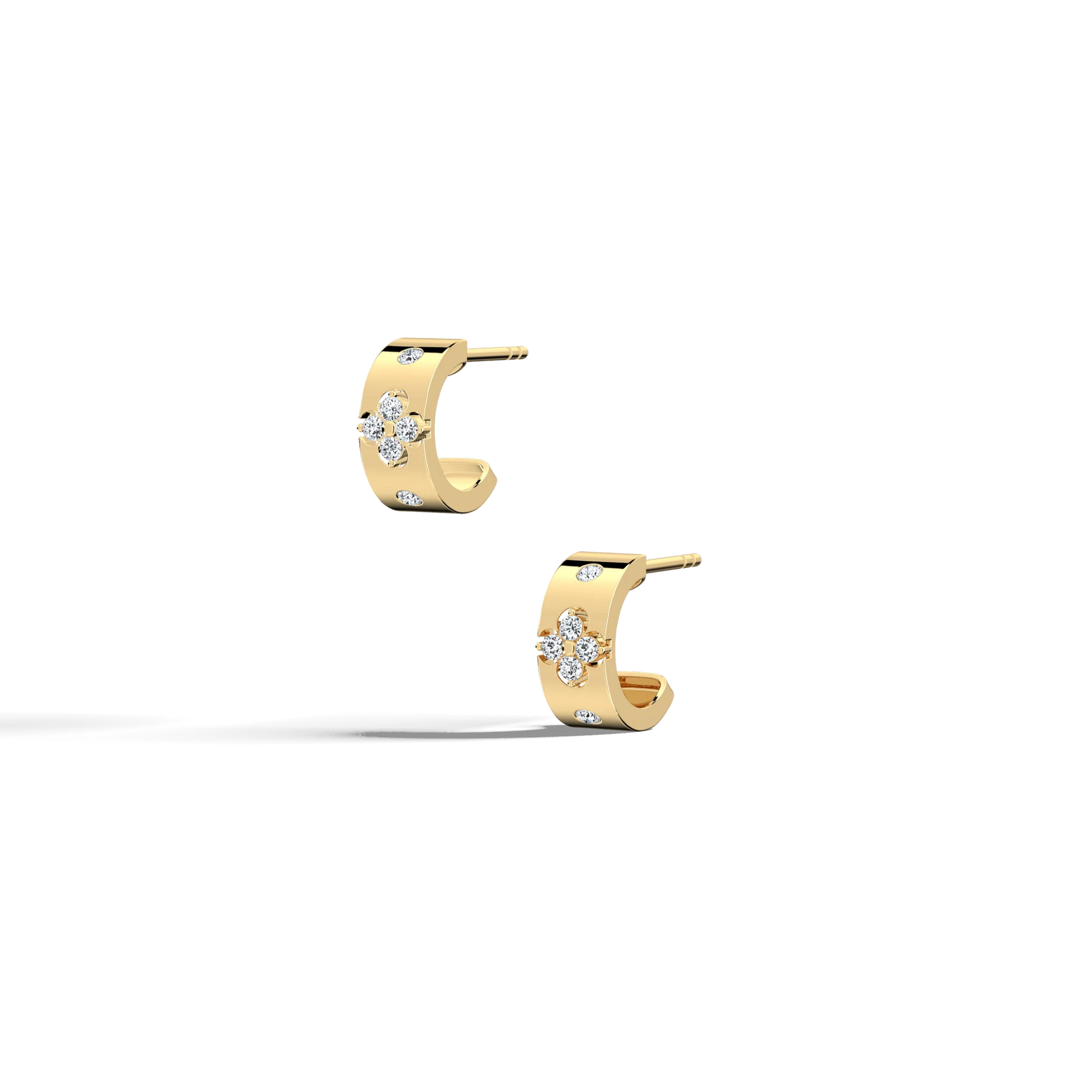 Gold hoop earrings with diamond accents on a white background