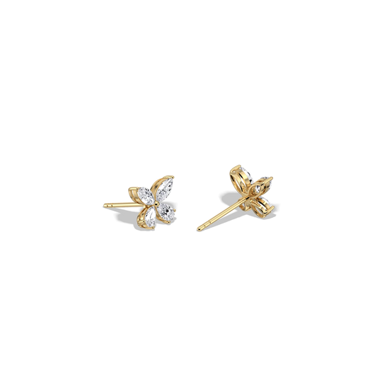 Gold butterfly earrings on a white background