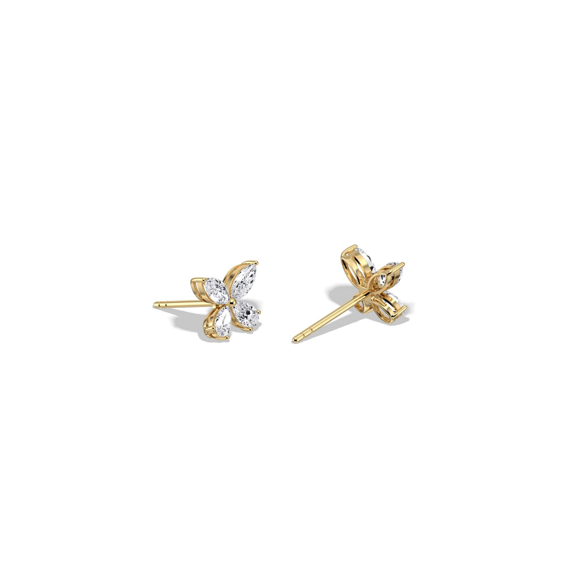 Gold butterfly earrings on a white background