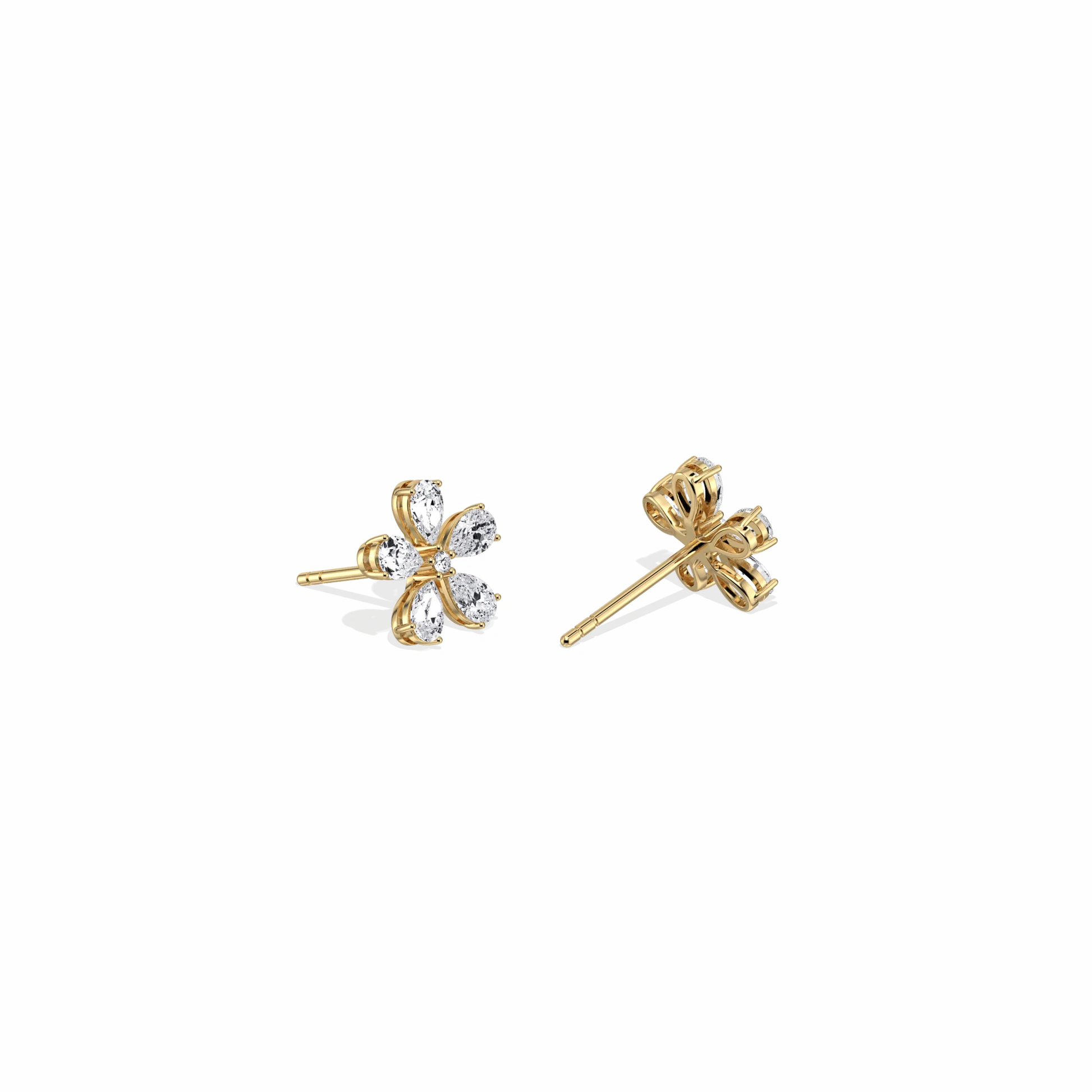 Gold and silver clover-shaped earrings on a white background
