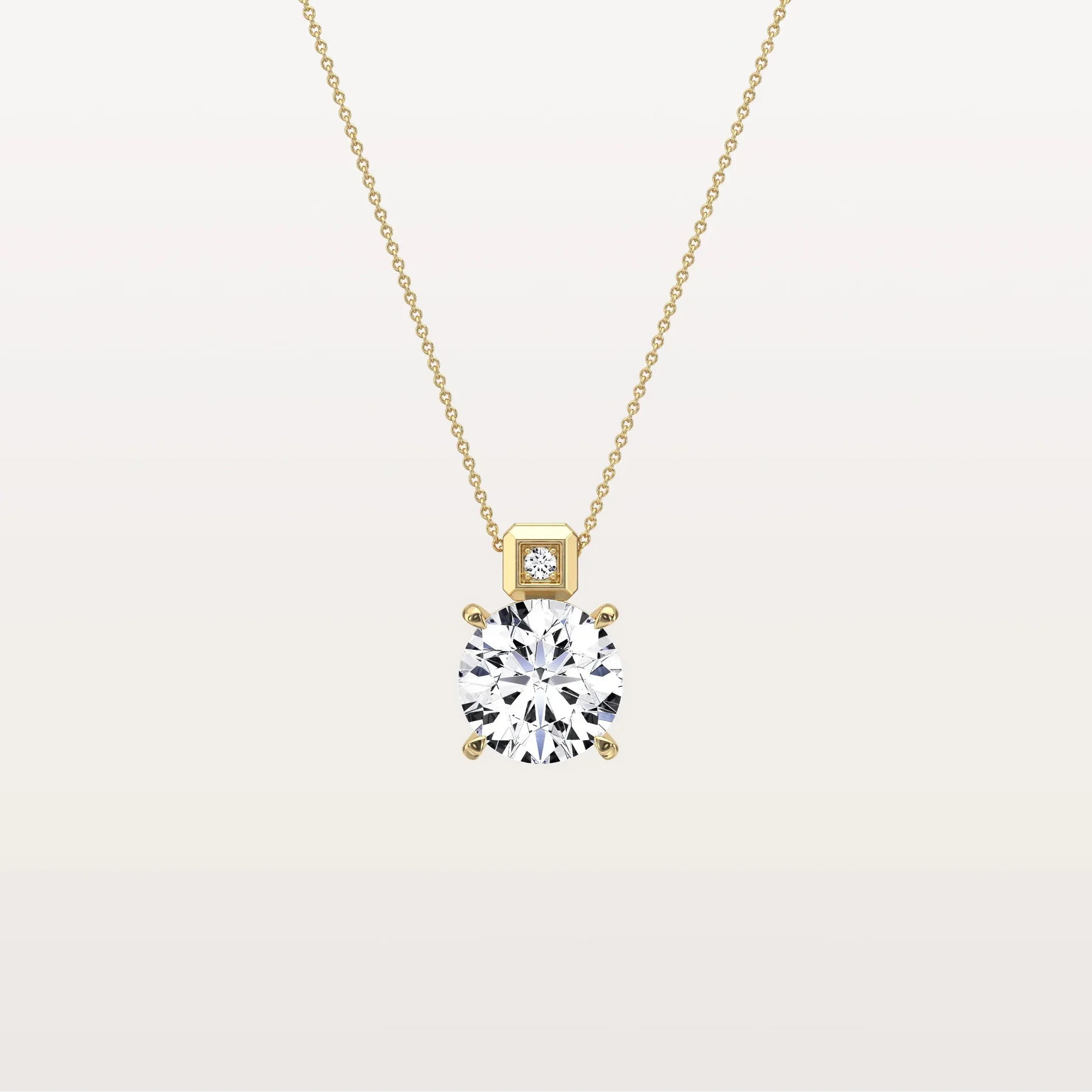 Gold necklace with a diamond pendant on a light beige background