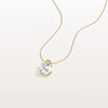 Gold necklace with a diamond pendant on a light gray background